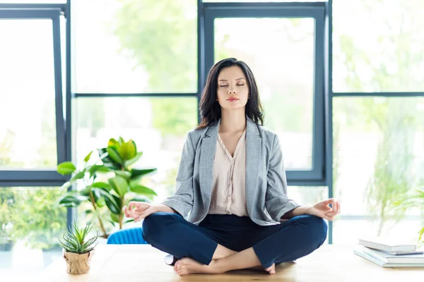 depositphotos 165479092 stock photo businesswoman meditating at workplace - Effective Stress Relief Tips for Women That Really Work.